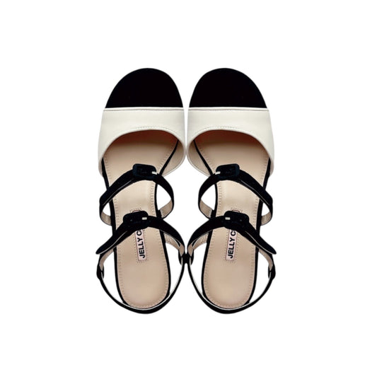 Black white, colour block leather shoes, vintage inspired pump sandals. Leather covered buckles.